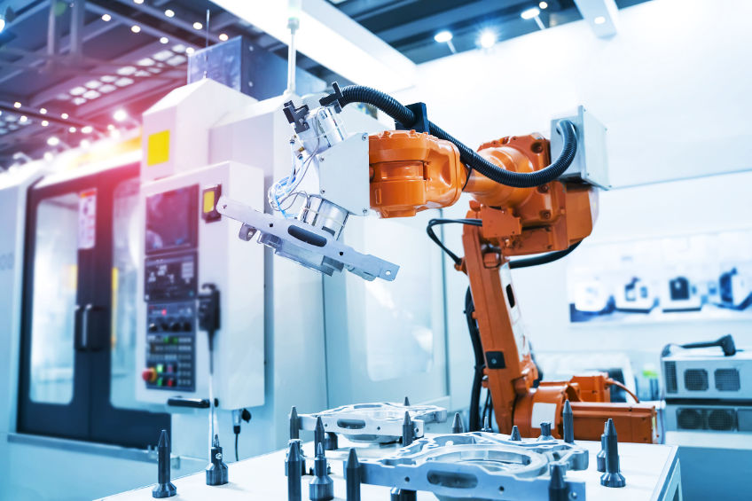 robot arm is working on CNC machine CNC Robotic Machined Component