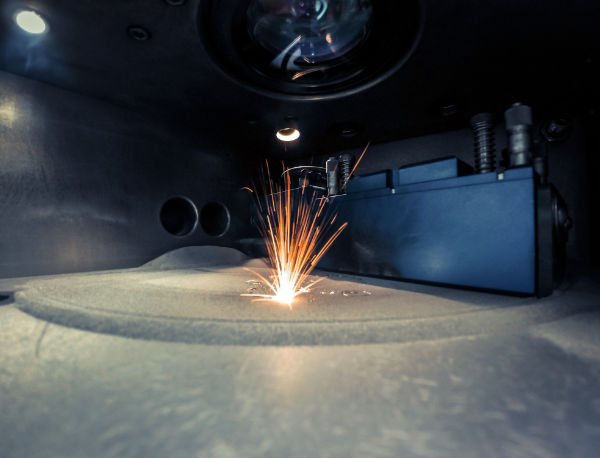 3D printer printing metal. Laser sintering machine for metal. Additive Manufacturing