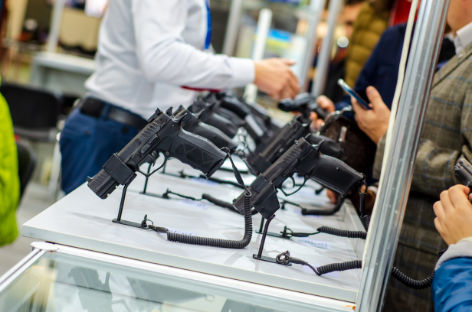 Gun Display Stands. Pistols for sale in the store. Small Arms Firearm Store